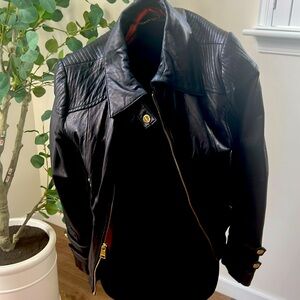 Bebe soft leather jacket with beautiful orange lining.   The leather is so soft.